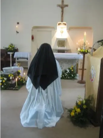 nun at adoration